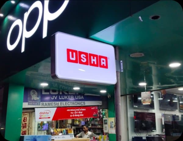 Lit fabric box signage at branded showroom